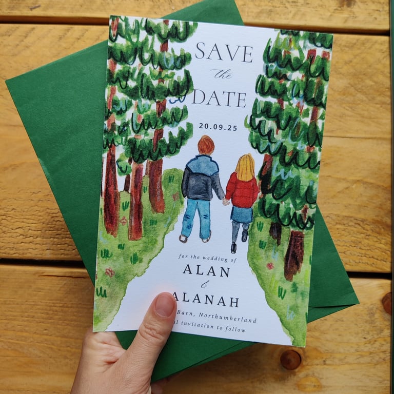 a save the date of a couple walking in the woods