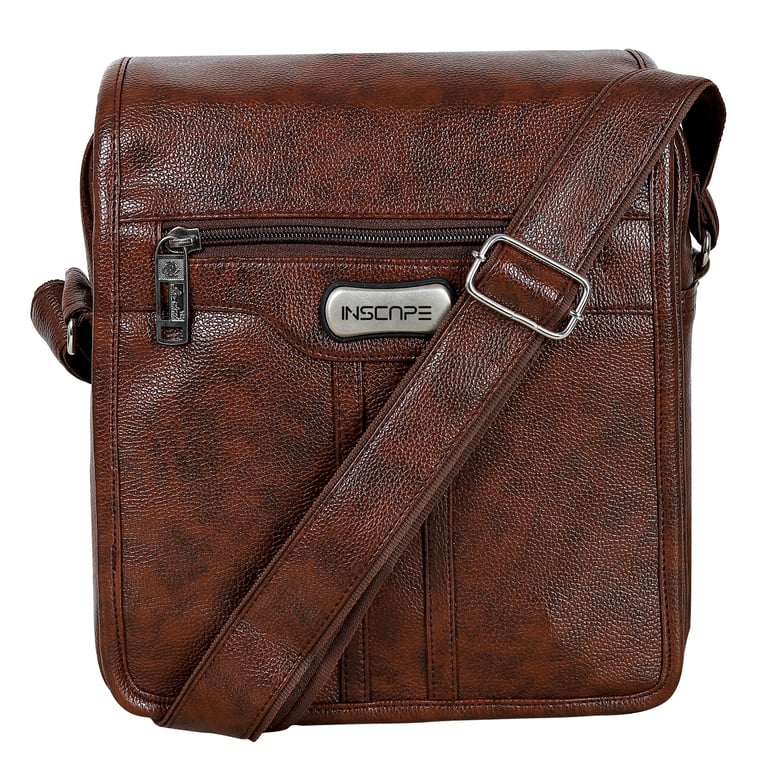a brown leather sling bag with a silver metal buckle