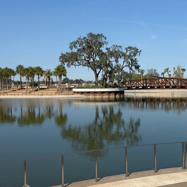 Man made lake and walking paths at Eastport Town Square in The Villages on a clear day