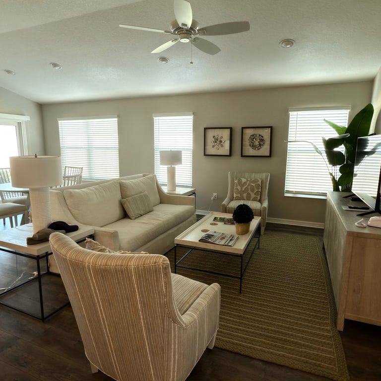 Living room inside our Well Point villa at The Villages with open layout and neutral furnishings