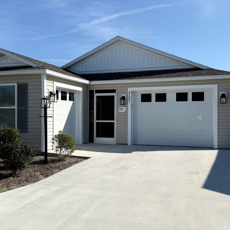 Exterior of our two bedroom villa in Well Point Village at The Villages with garage and driveway