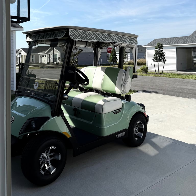 Villages Lime and White Golf Car parked outside villa on sunny day