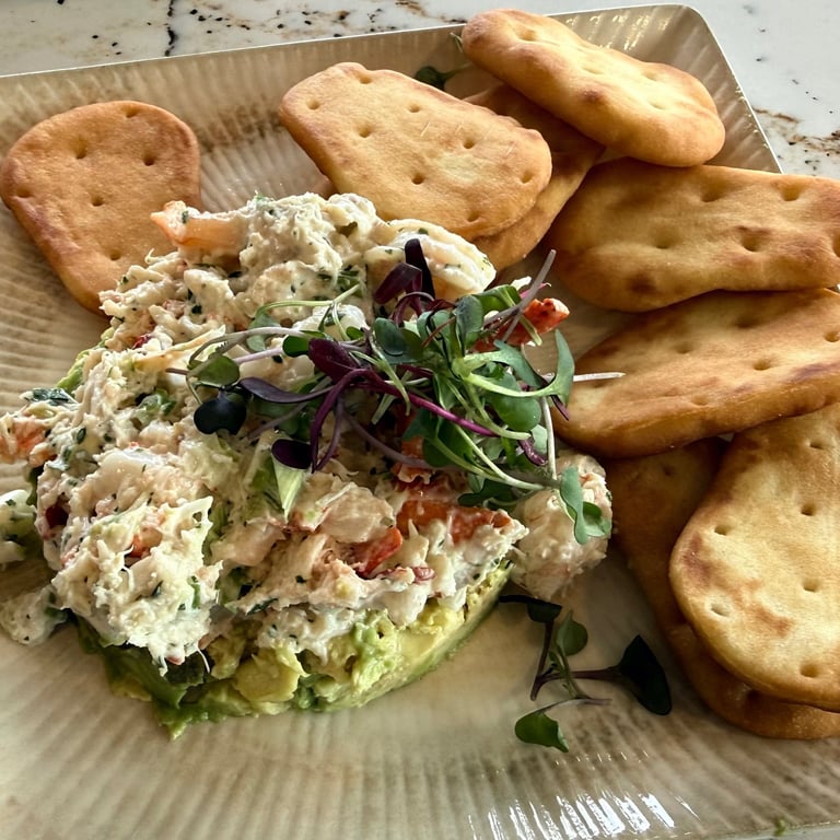 Appetizer plate with seafood salad and crackers enjoyed at Prime & Ember restaurant in Eastport