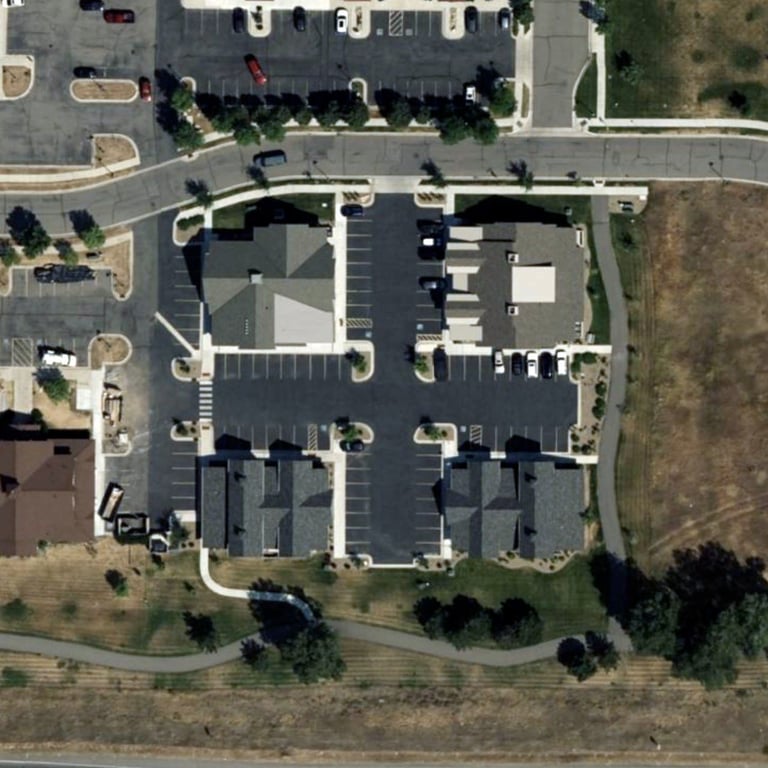 a large building with a lot of parking spaces