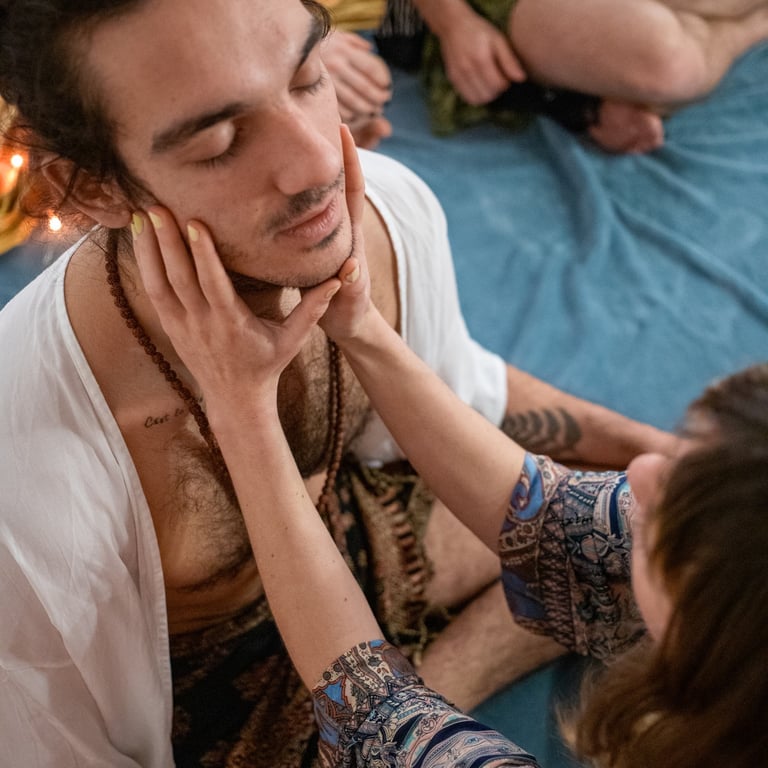 a man with a beard and a woman in a white shirt