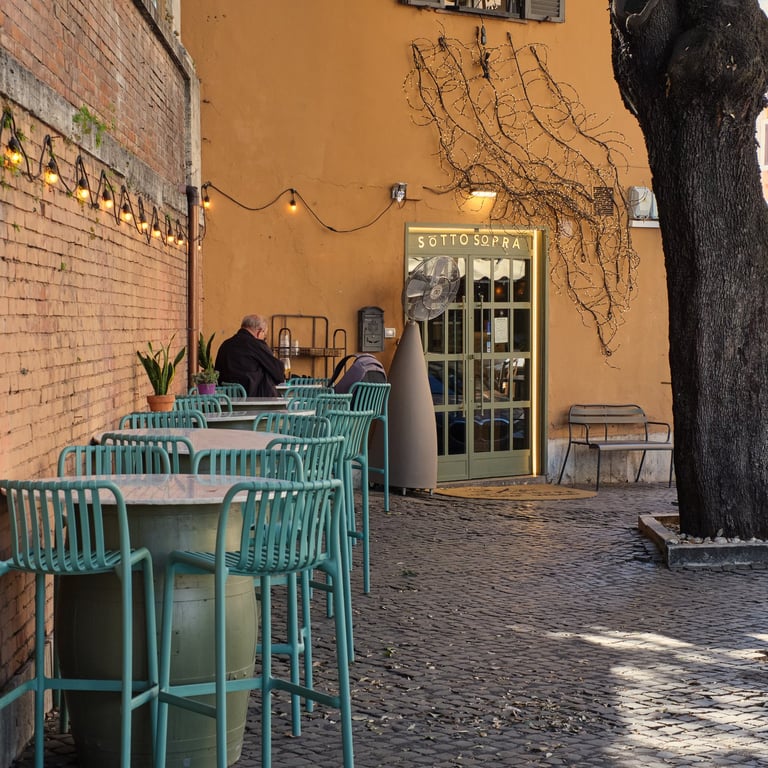 fotografia di un signore seduto ad un bar a Roma
