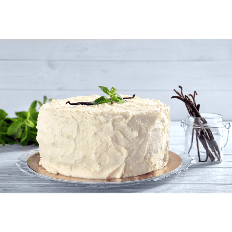 a cake with vanilla cream frosting and vanilla beans