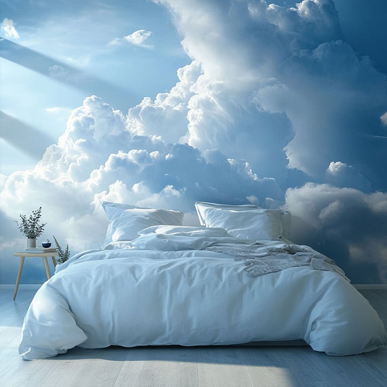 Modern bedroom with white bedding and a large wall mural of fluffy clouds and blue sky.