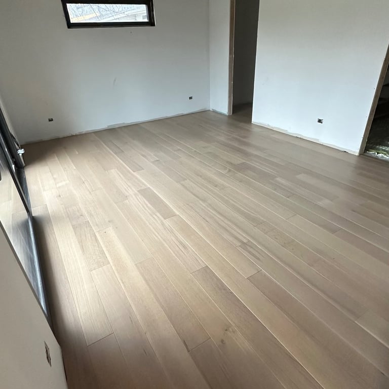 Wide plank engineered hardwood installation in modern rustic home renovation
