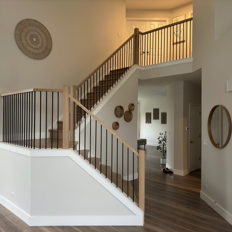 Staircase renovation replacing wood spindles with modern iron balusters Lake in the Hills