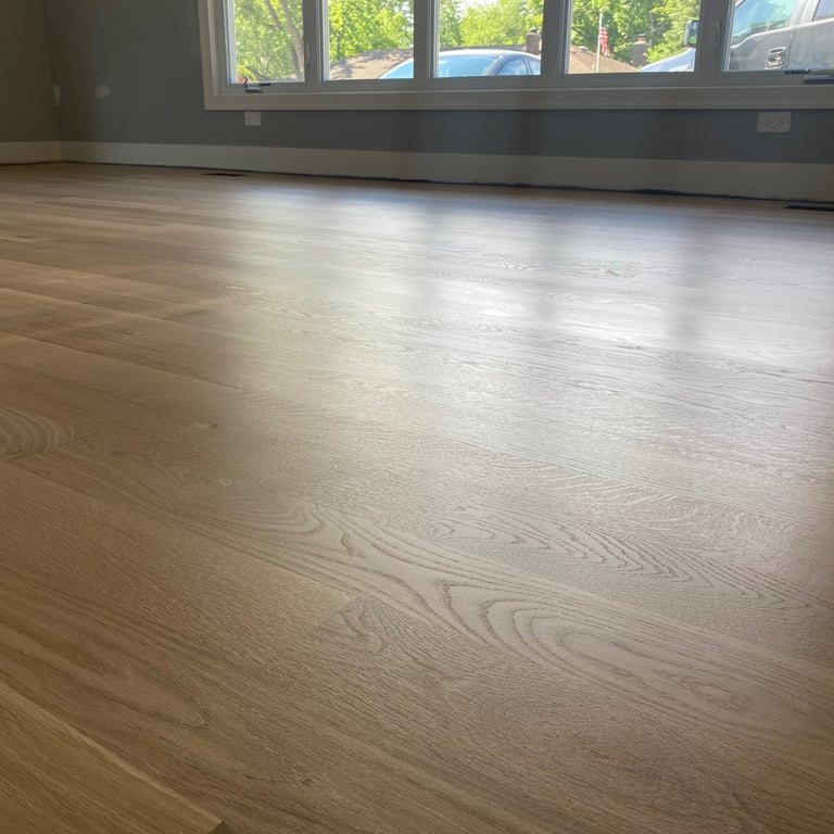 Natural matte finish white oak flooring installation in large living room