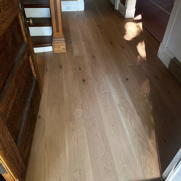 Seamless hallway flooring transition installation luxury engenered floor