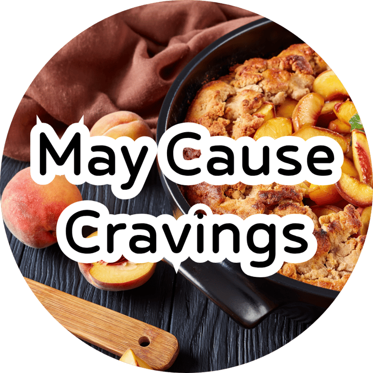 Warm peach cobbler in a skillet with fresh peaches and overlay text reading "May Cause Cravings."