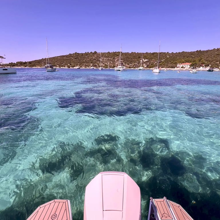 Stunning turquoise and crystal-clear sea at Blue Lagoon, taken from speedboat in Croatia on a private boat tour from Split