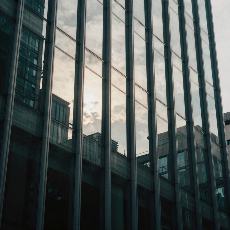 Abstract photography of light reflecting on glass in a modern office building, using dark teal and off-white tones.