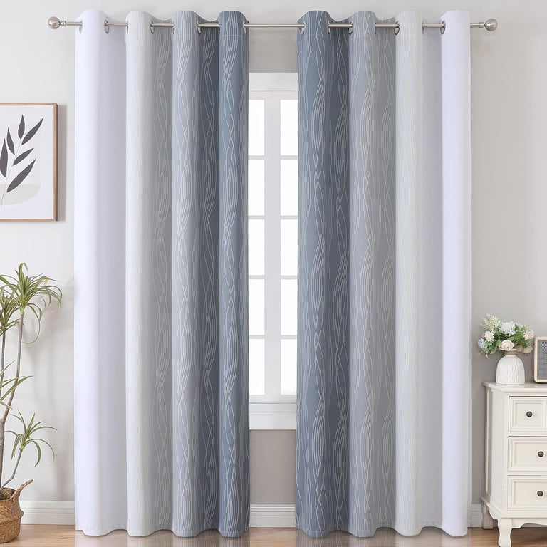 Modern grey and white gradient blackout curtains with a wavy line pattern hanging on a silver rod.