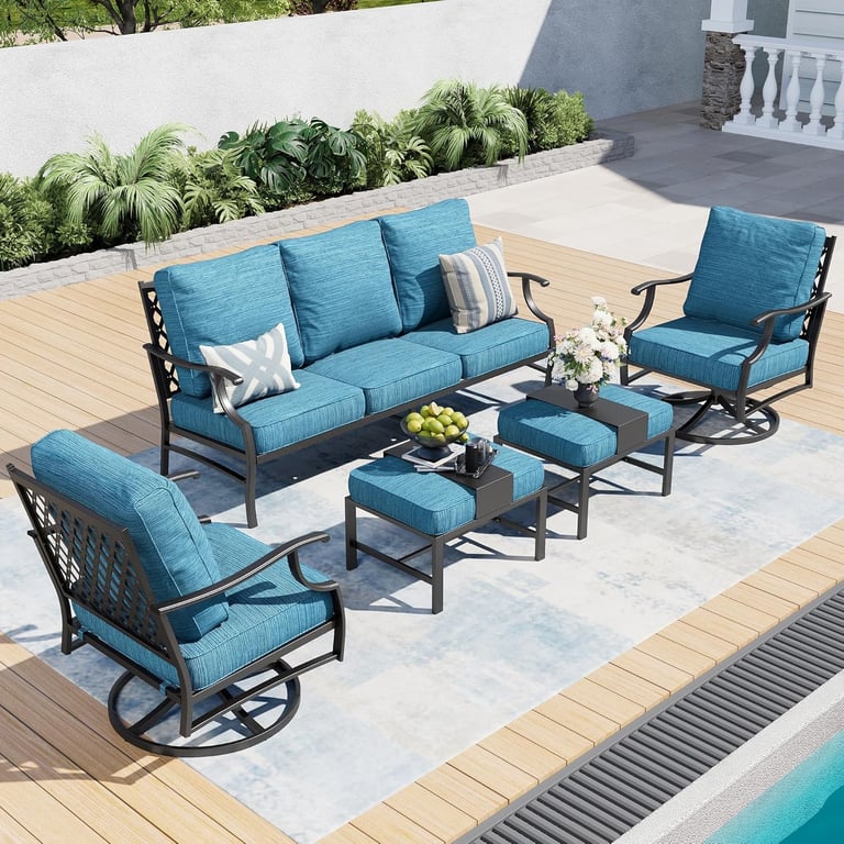 Modern 6-piece outdoor patio furniture set with blue cushions, metal sofa, and swivel chairs by a pool.