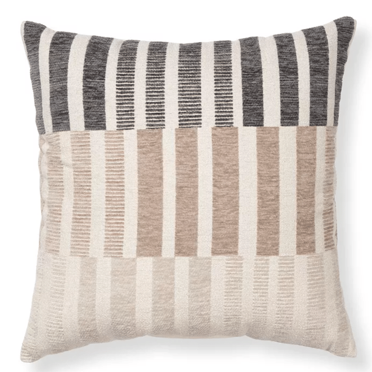 Modern decorative throw pillow with black, tan, and cream striped textured patchwork design.