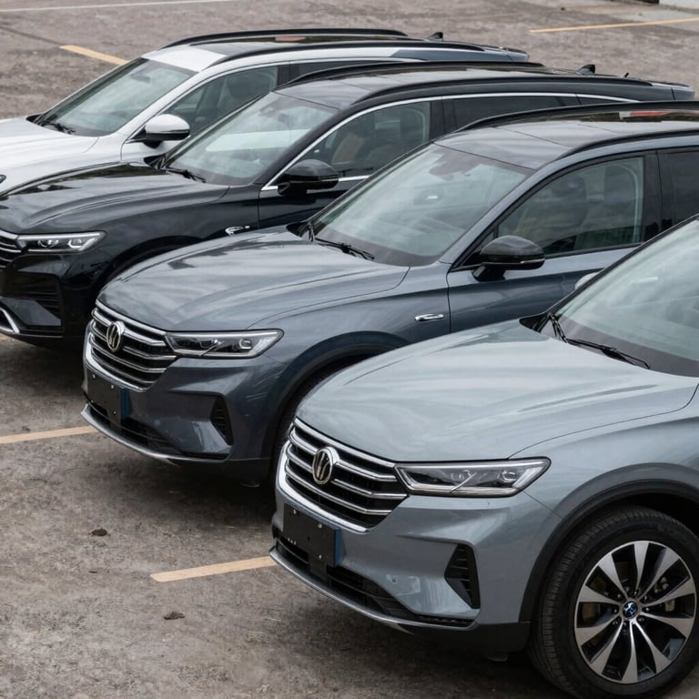 A fleet of three high-end SUVs in various shades of Deep Charcoal and Mist Grey, perfectly detailed and lined up.