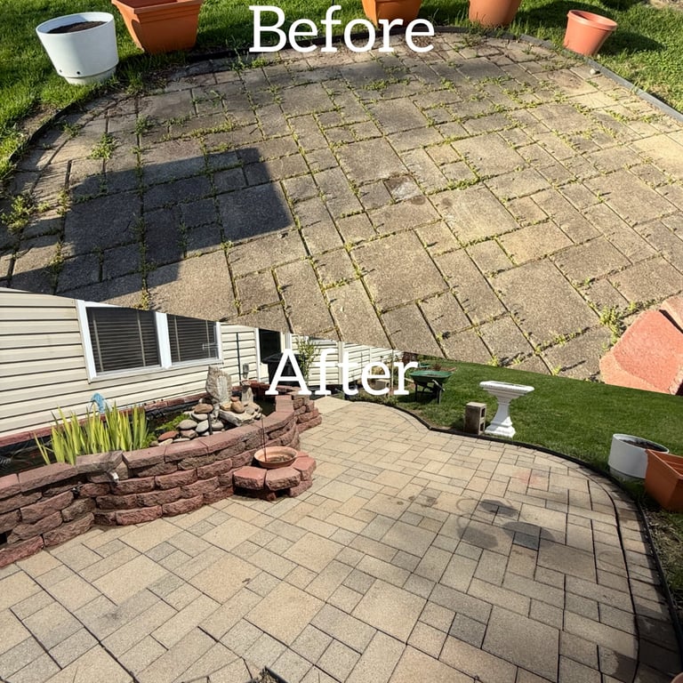 Before and after backyard patio renovation featuring cleaned stone pavers and a new tiered retaining wall.