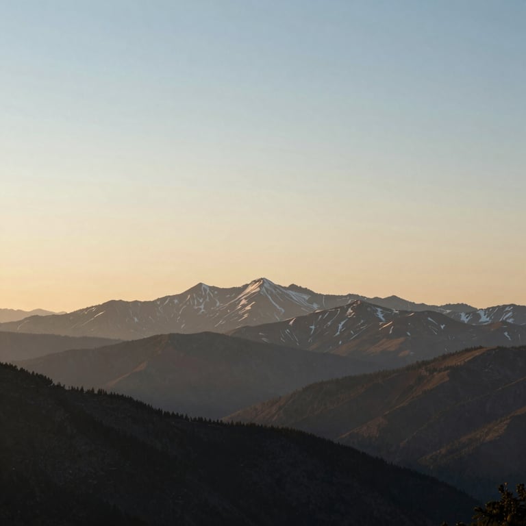 A peaceful North American mountain landscape at dawn, featuring soft cream and blue sky tones to represent new beginnings.