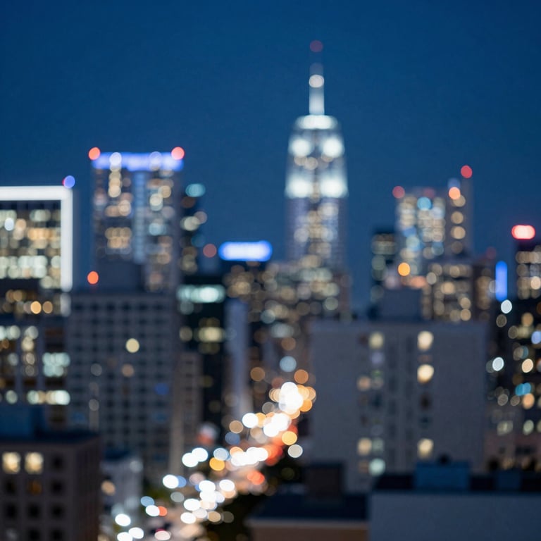 Photography of an abstract bokeh shot of city lights at night in a US metropolitan area, featuring deep sapphire blue and light blue-white tones.
