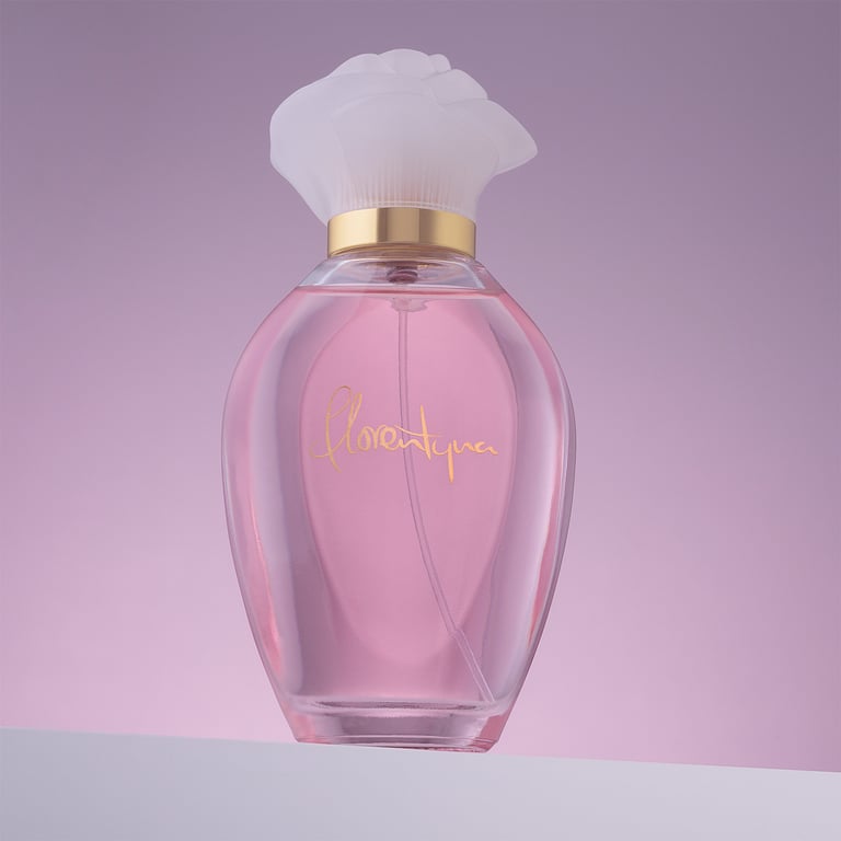 Bottle of perfume on white shelf