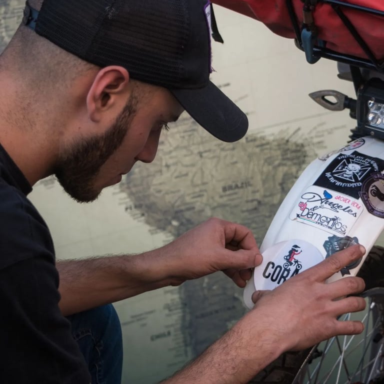 a man in a cap is working on a bike