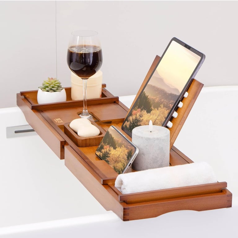 a tabletop with a tablet and a glass of wine