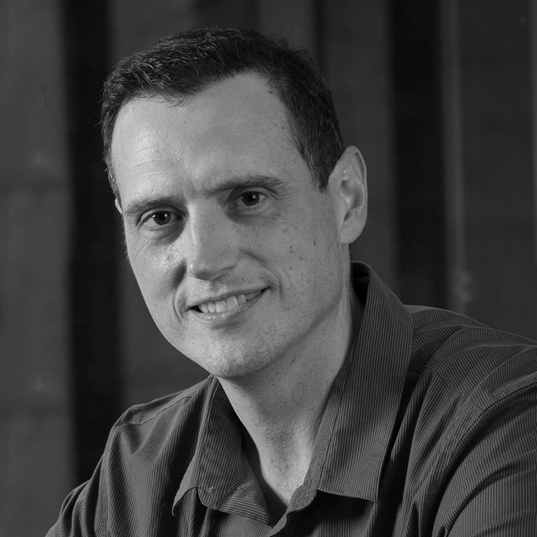 a man in a black shirt and a cell phone