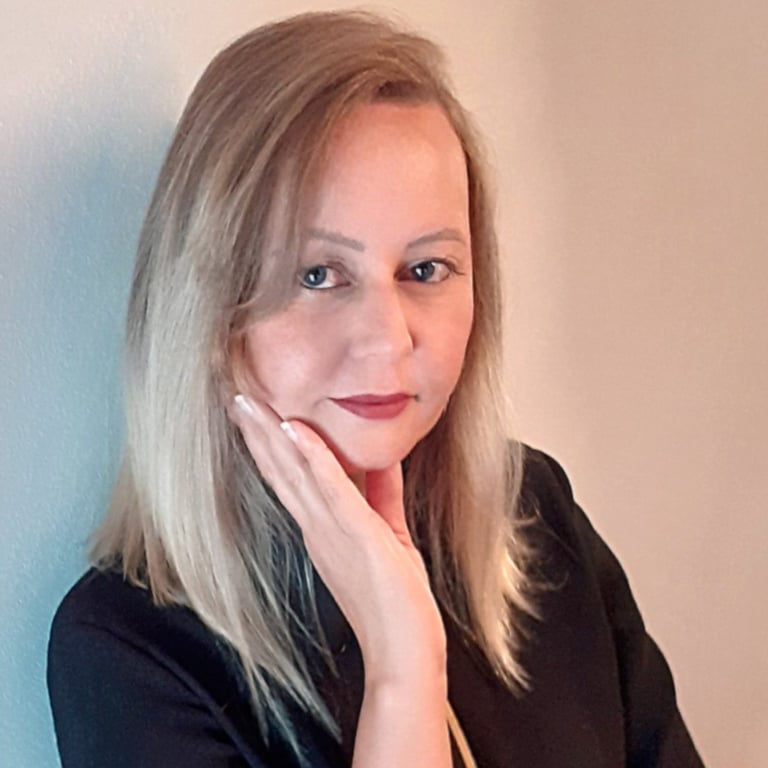 a woman with blonde hair and a black top