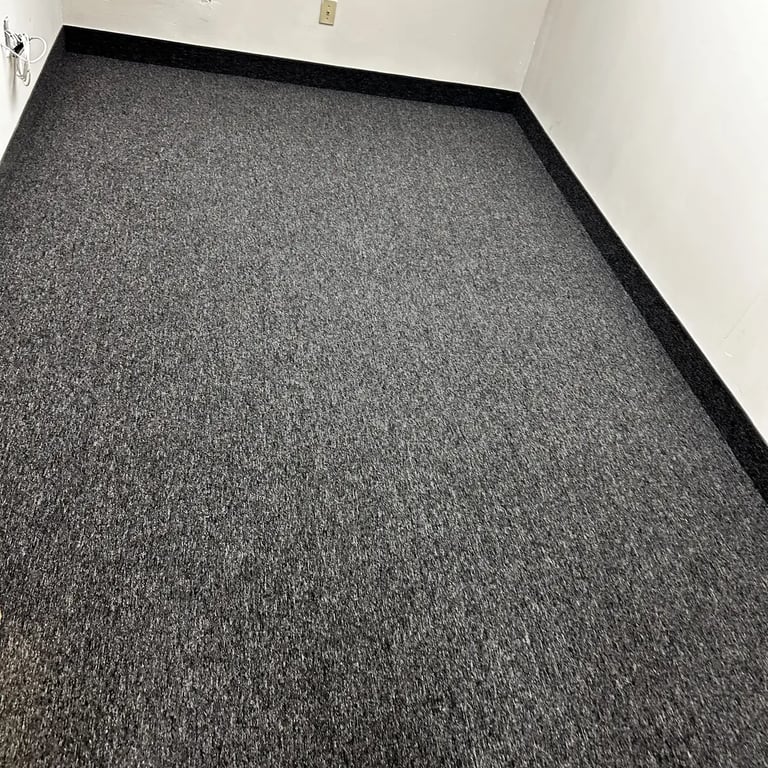 Charcoal commercial carpet installed wall-to-wall in office room in London Ontario, durable and modern flooring