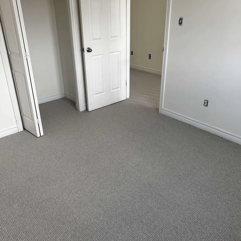 Naples Berber carpet installed in a bedroom with closet – durable and textured carpet flooring
