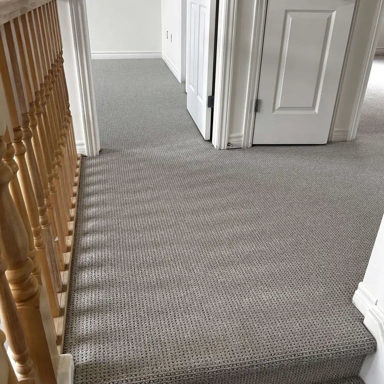 Naples Berber carpet installed in a hall next to spindles – durable textured flooring