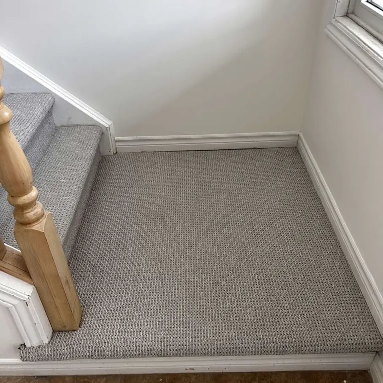 Naples textured Berber carpet installed on stairs with landing in London – beige looped carpet offering a durable and stylish
