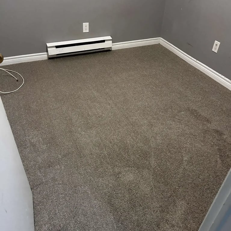 Basement carpet installation in London, Ontario featuring Serenity Light Sand — a soft, durable plush carpet.