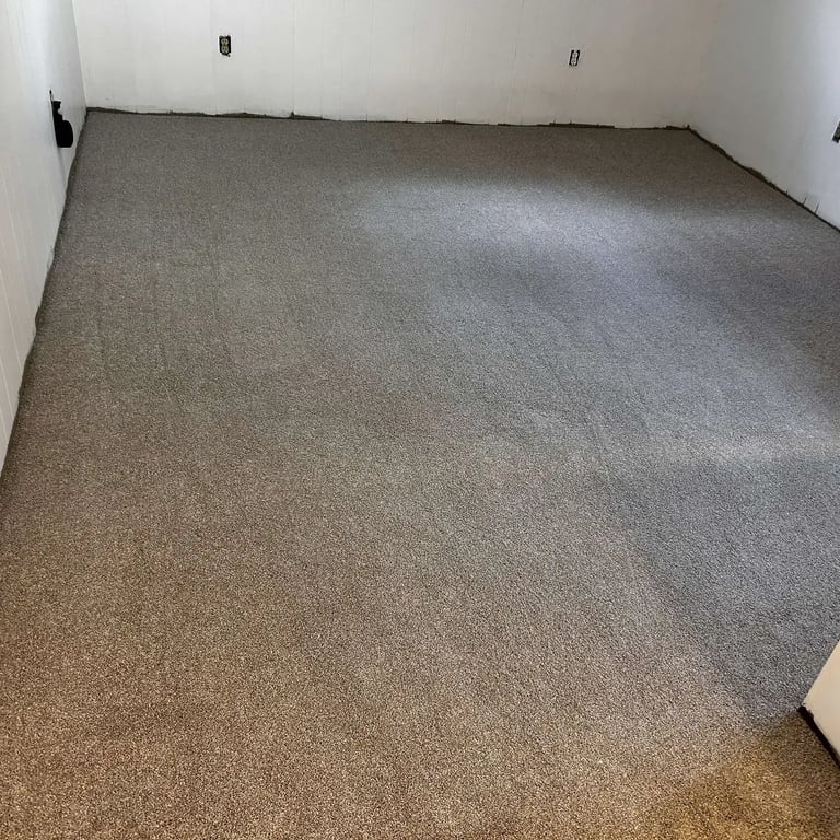 Living room carpet installation in London, Ontario featuring Serenity Light Sand — a soft, plush medium-pile carpet.