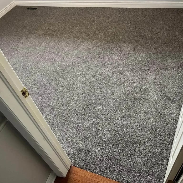 Bedroom carpet installation in London, Ontario featuring Serenity Pathway — a modern taupe plush carpet.