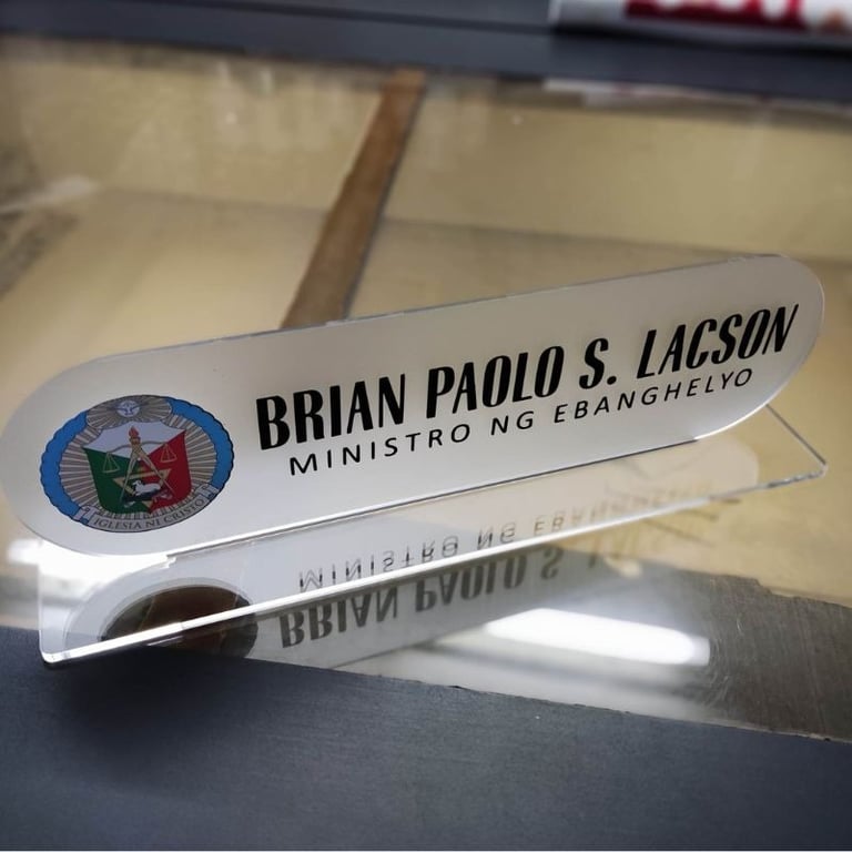 Frosted acrylic desk nameplate with church emblem.