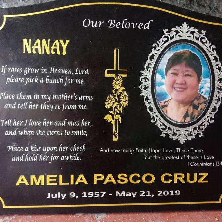 Engraved granite memorial stone with photo and golden accents for Amelia.