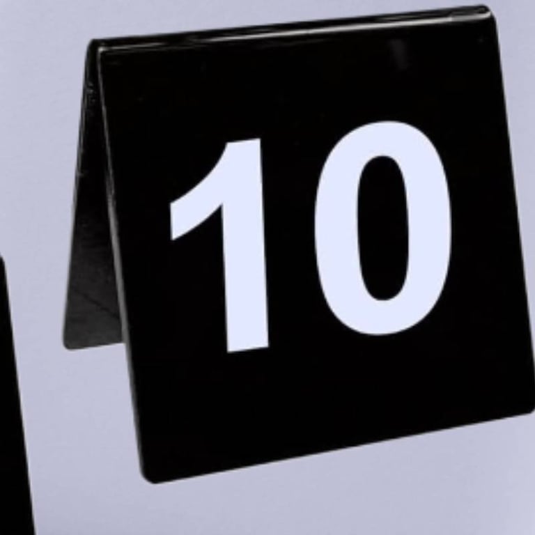 Black Acrylic Table Tent with a number 1 and 10 white font