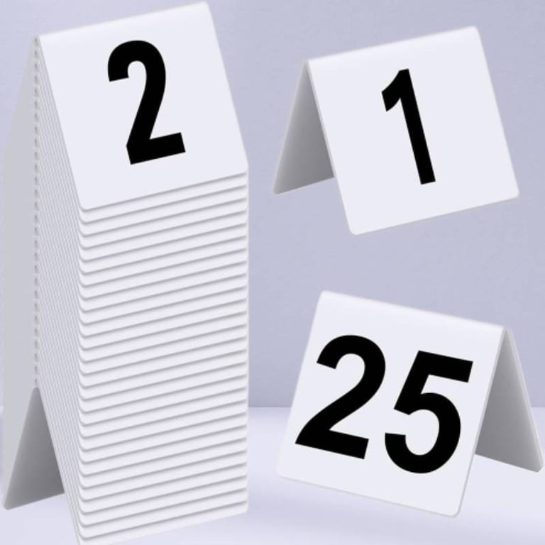 White Acrylic Table Tent with a number 1- 2- 25 with black font, with multiple stacks on 2