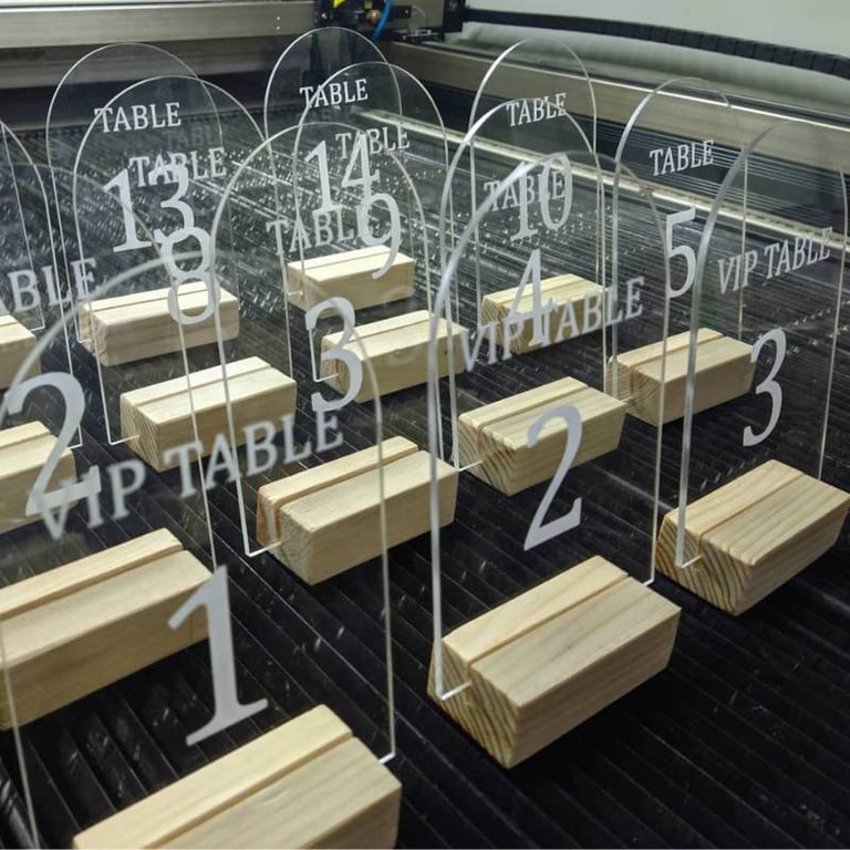 Array of clear Acrylic Table Numbers with bold black script for tables 1 through 5 and VIP precision