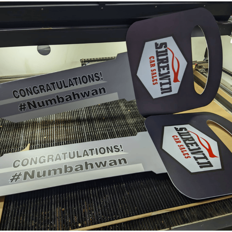 Celebratory car sales sintra board sticker with hashtag and logo.