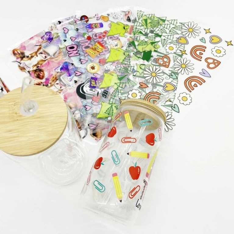 bunch of DTV UV stickers and 2 Soda jar with 1 full decorated stickers