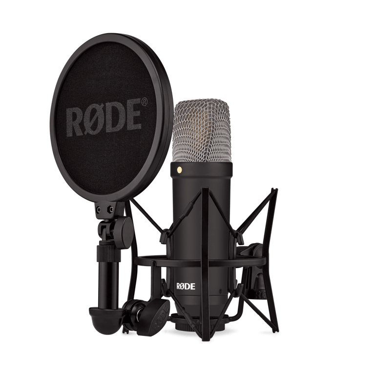 Sharifa Mclaughlin recording voiceover in UK studio with microphone