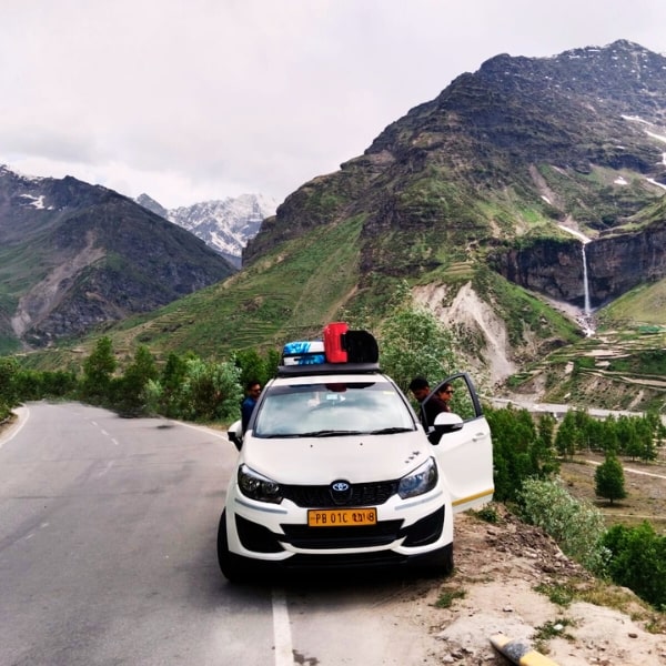 a car parked on a mountain side road