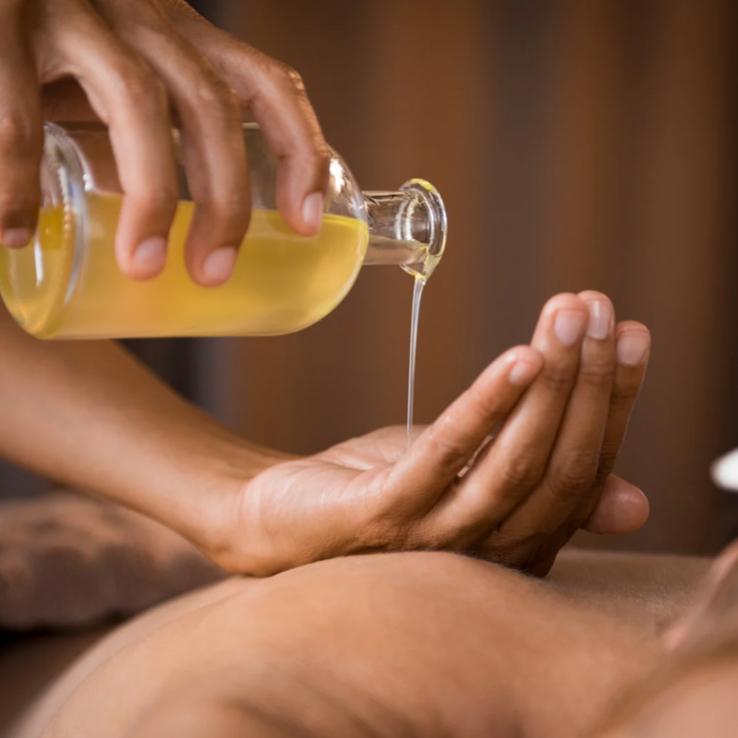 Aromatherapy massage with essential oils for stress relief in Seminyak