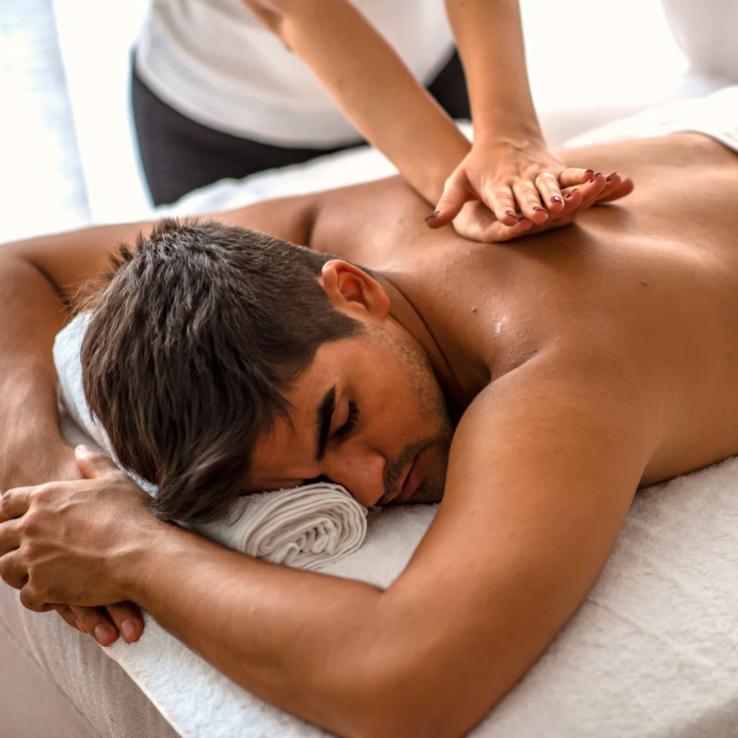Deep tissue massage therapy targeting muscle knots and chronic tension in a professional spa setting