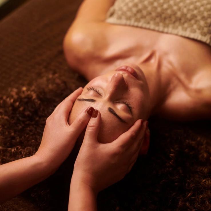 Professional head and shoulder massage treatment at a luxury Bali spa
